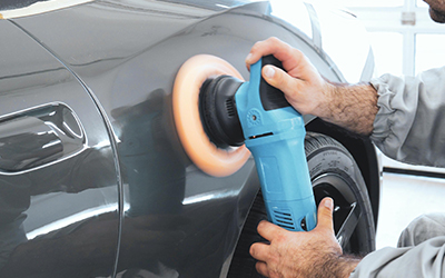 Close up of a car repair being buffed