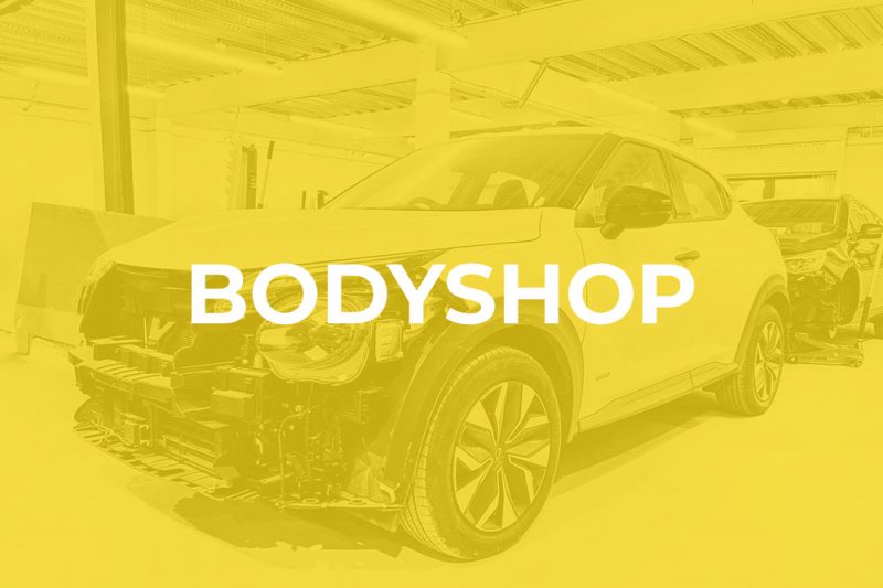 Vehicle at Dack Bodyshop Lincoln with Yellow Overlay