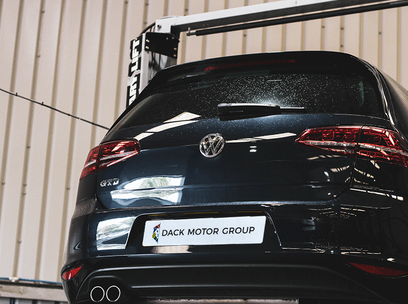 VW Golf on a ramp for repairs at Dack Motor Group