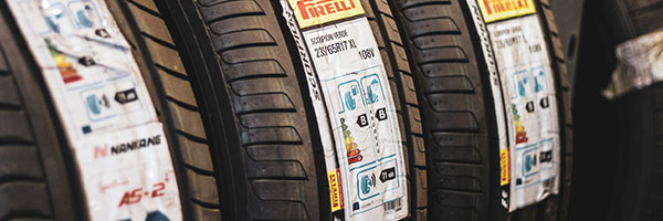 Tyres on a rack, ready to go on cars