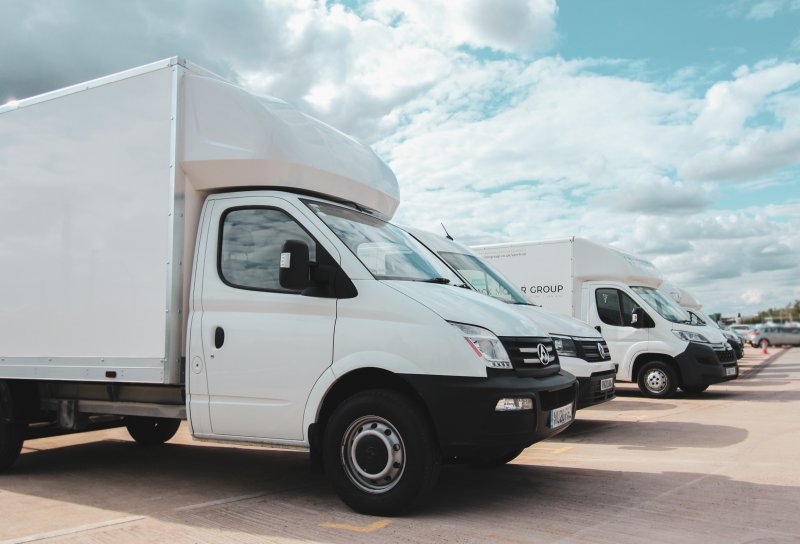 Photo of White Luton Vans Sat In A Row Outside Dack Motor Group